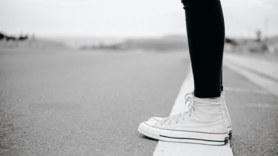 girl standing on a white line