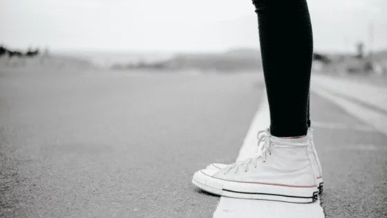 girl standing on a white line