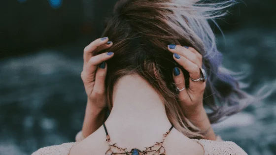 girl covering her ears