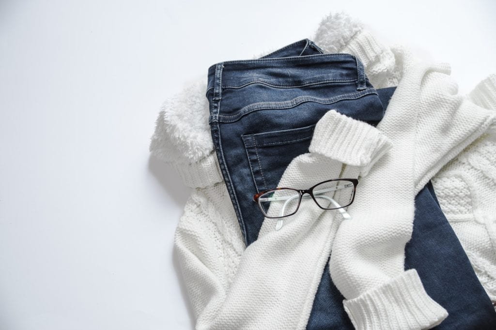 black-framed-eyeglasses-on-white-jacket-and-blue-denim