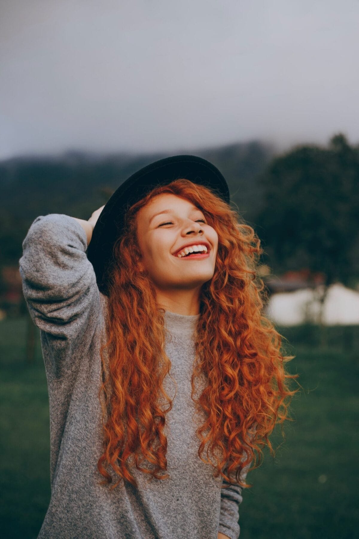 girl with red hair laughing