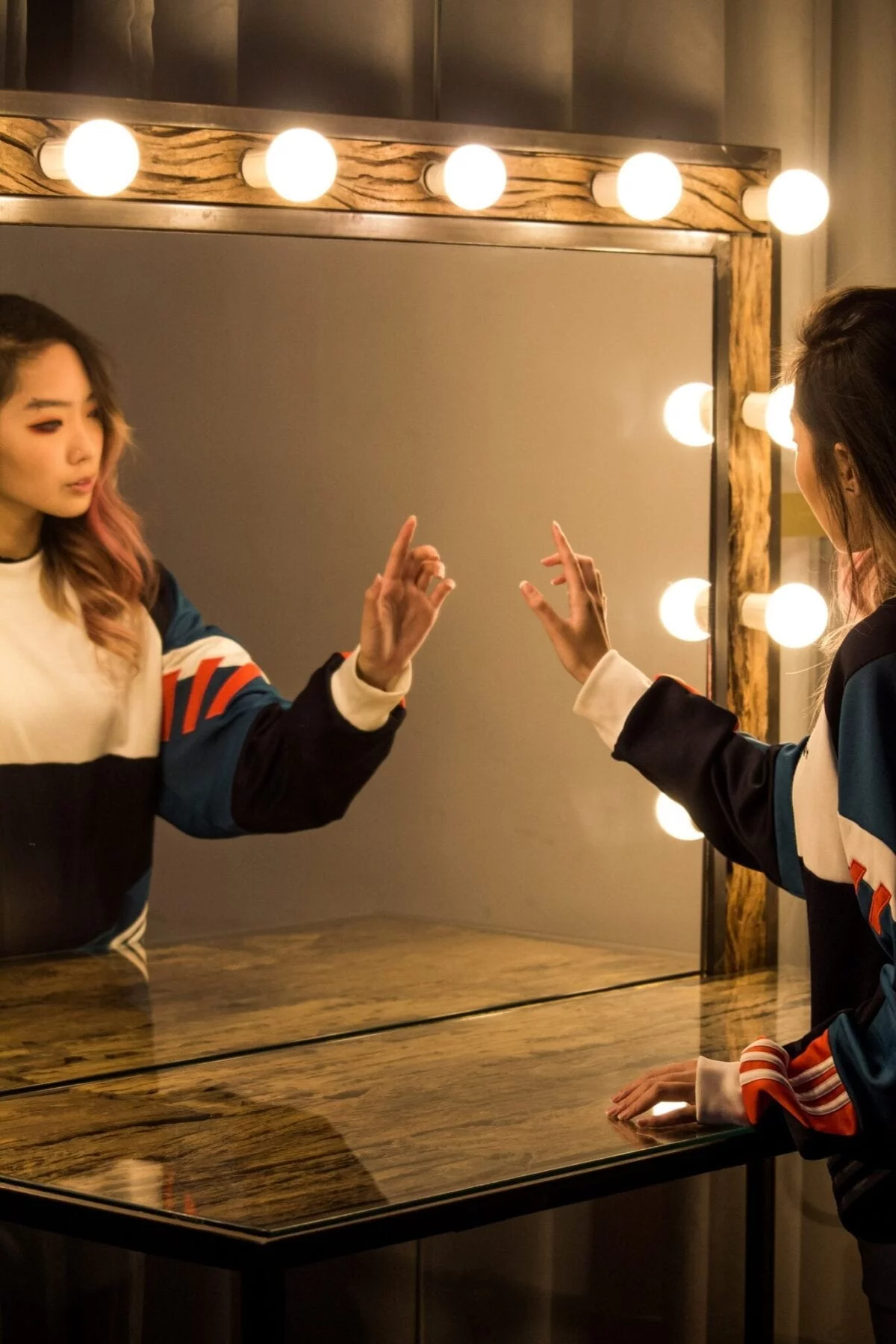 woman point at mirror