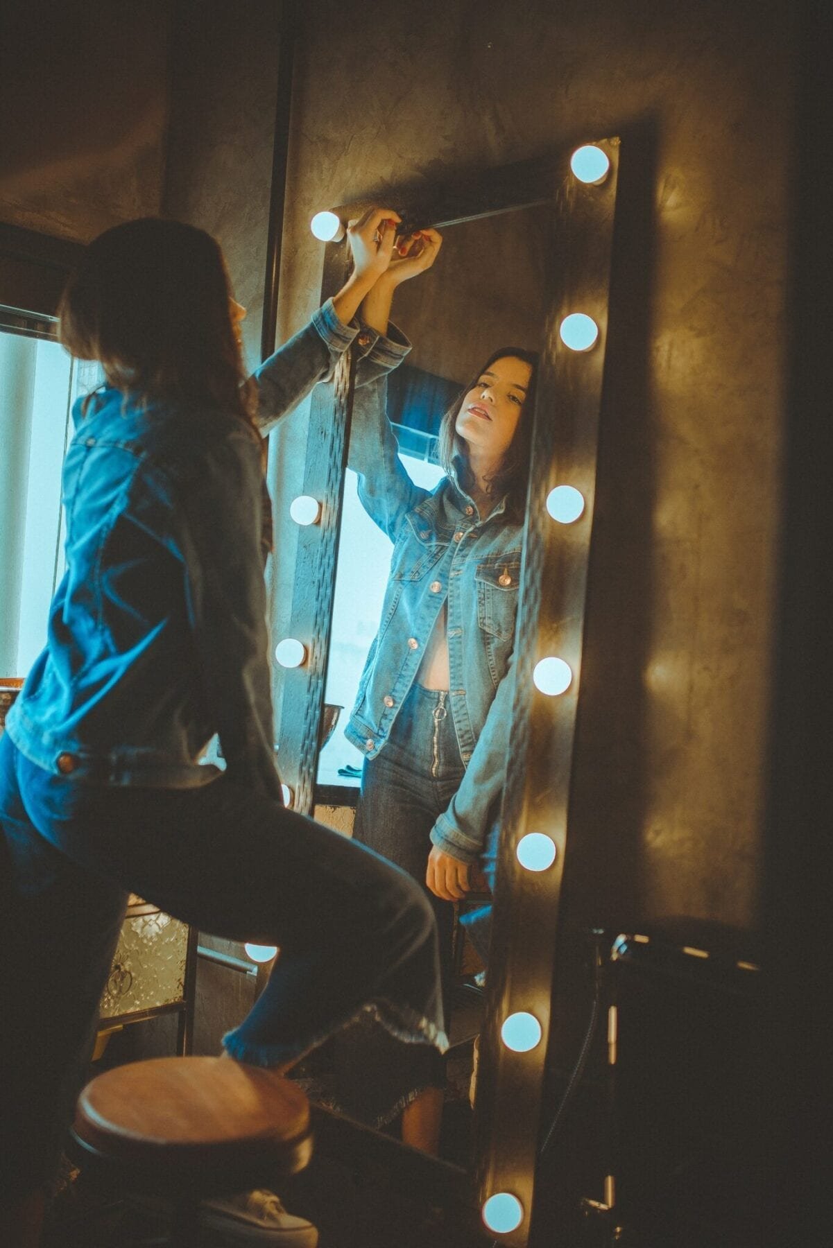 Woman in front of mirror