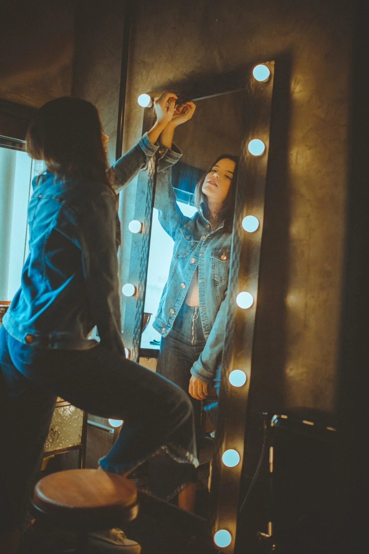 Woman in front of mirror