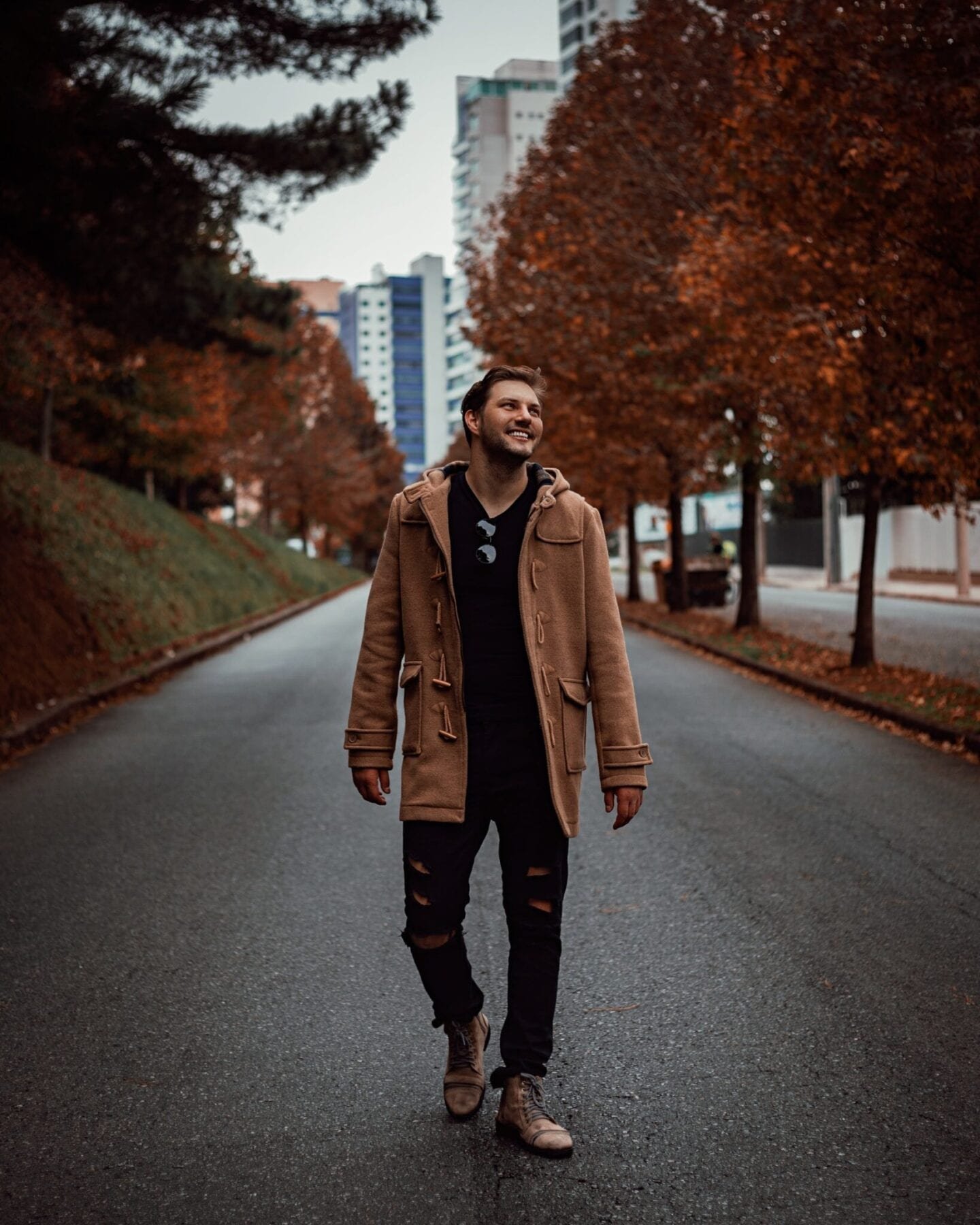 man in brown jacket walking