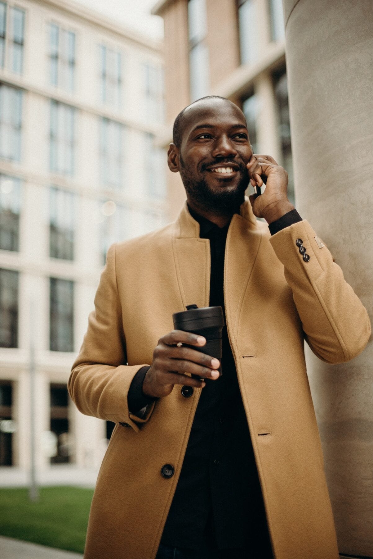 Man Wearing Brown Jacket Using Smartphone While Using Smartphone