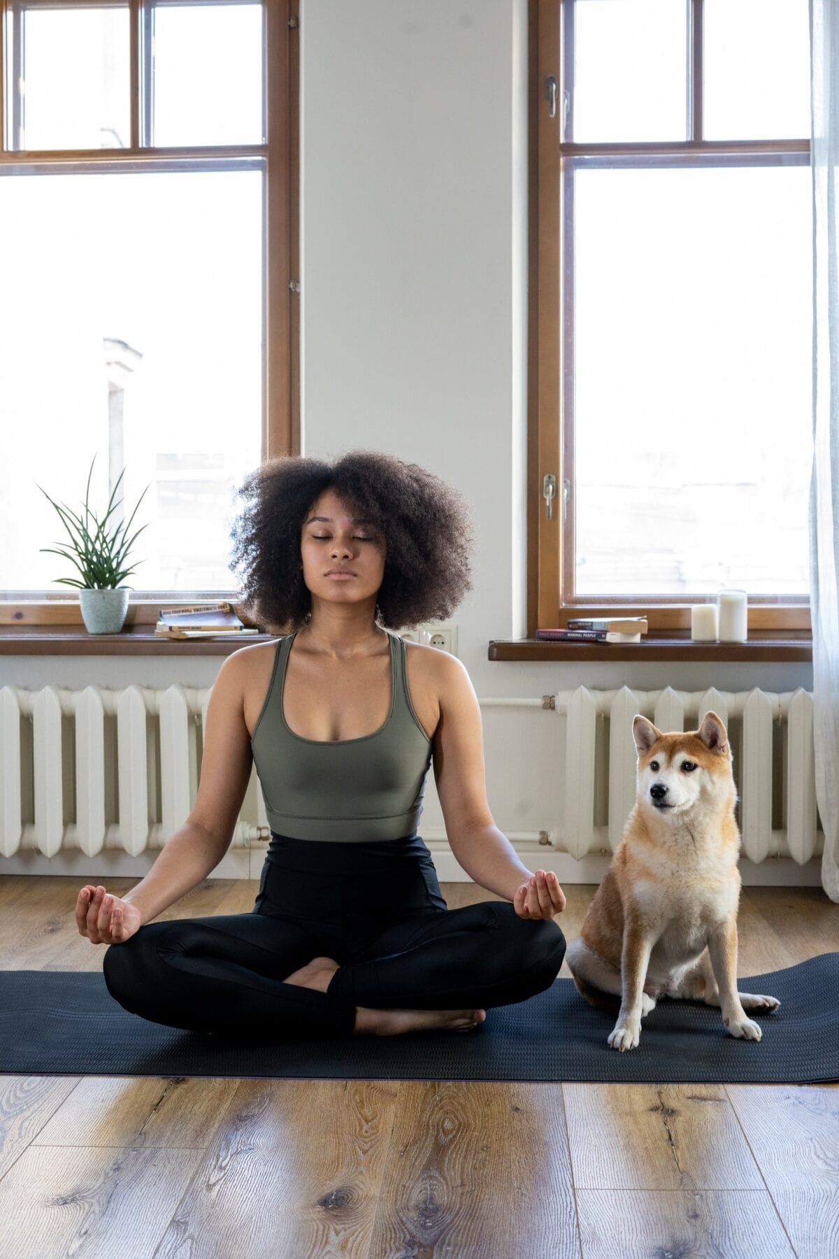 girl meditating with her dog