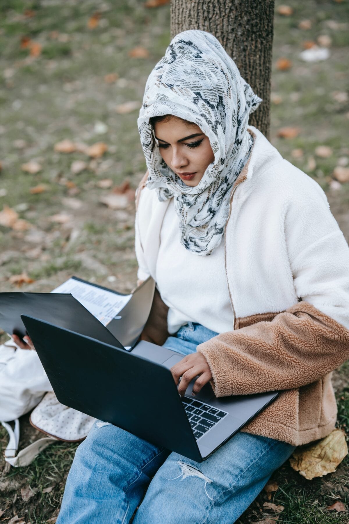 Woman in White Hijab Using Black Laptop Computer