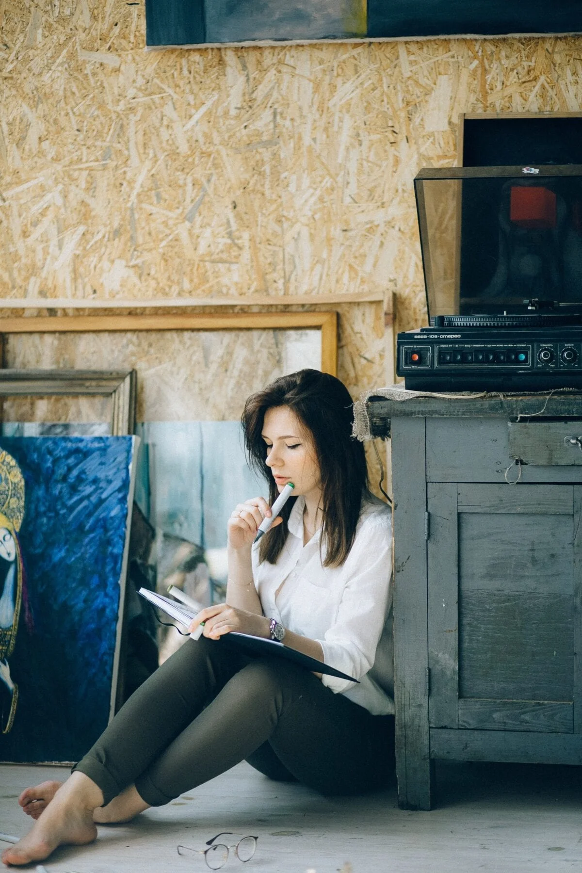 woman sitting on the floor thinking