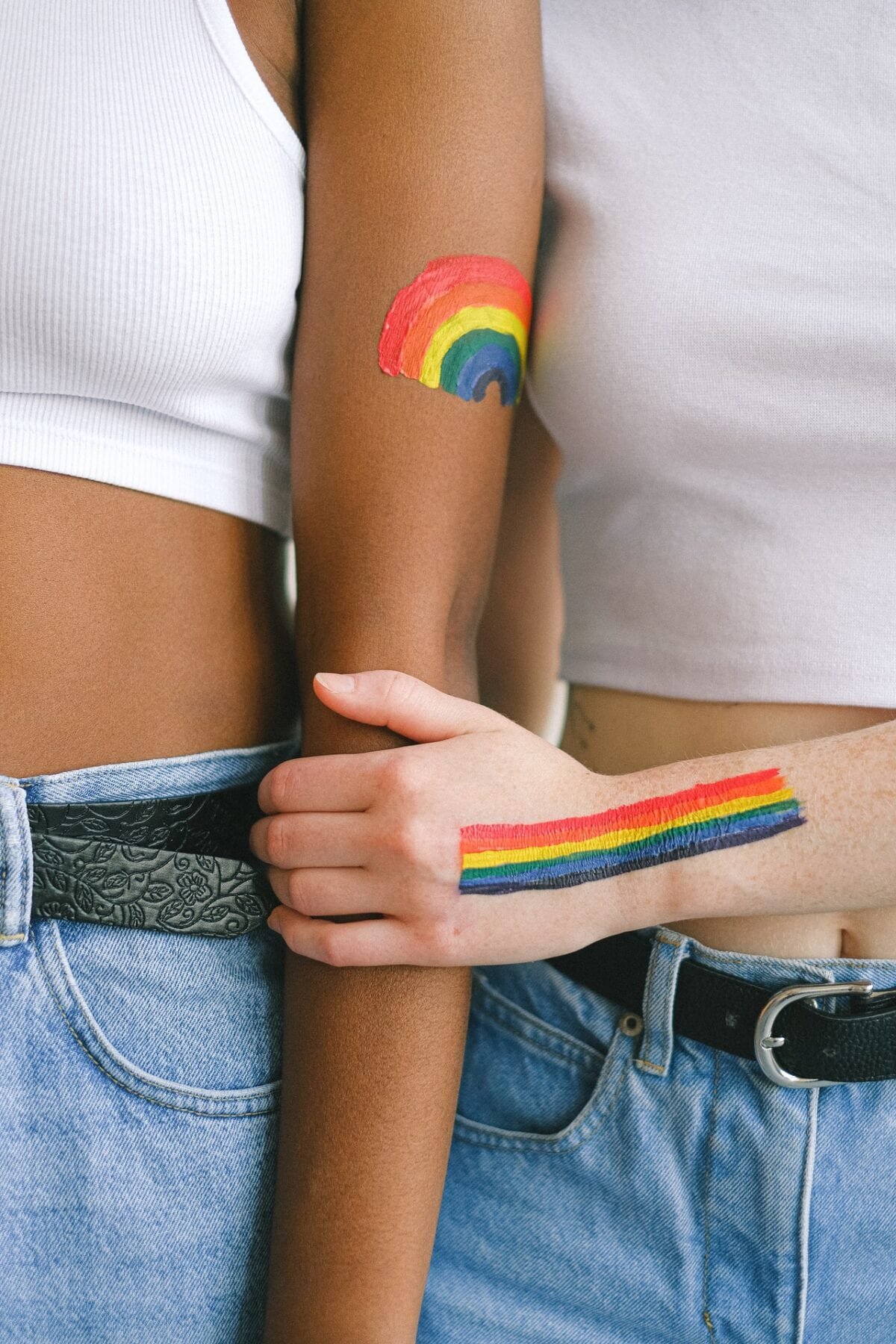 two lgbtq women holding hands