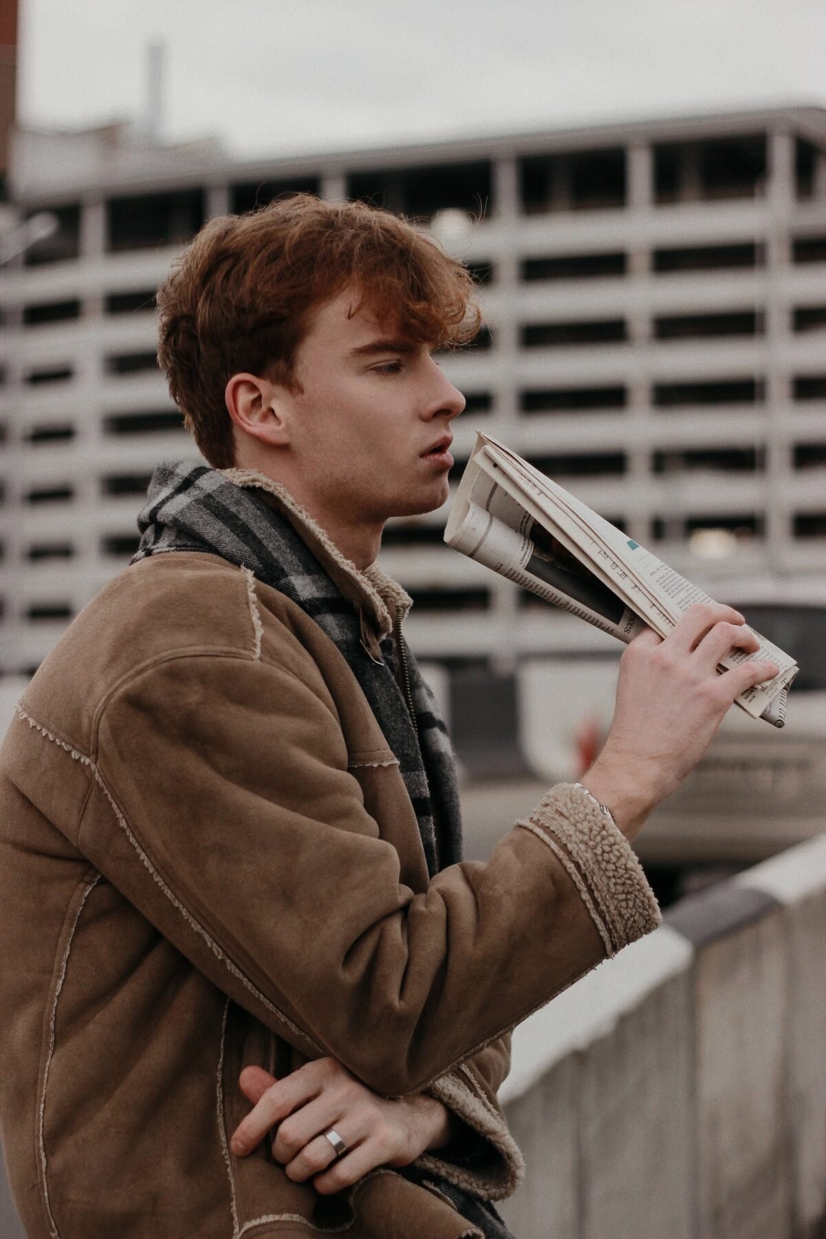 men holding newspaper