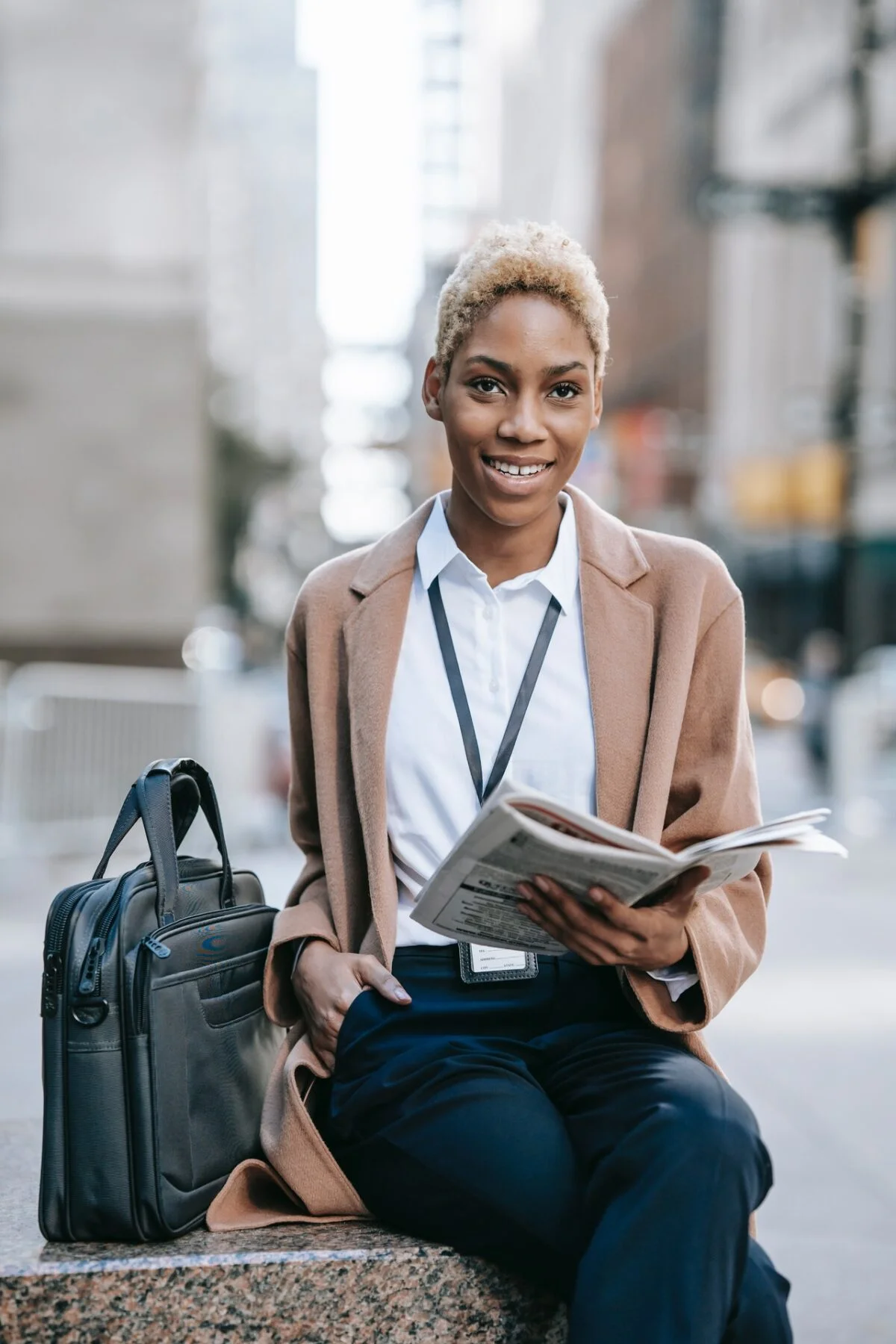 woman holding a newspaper