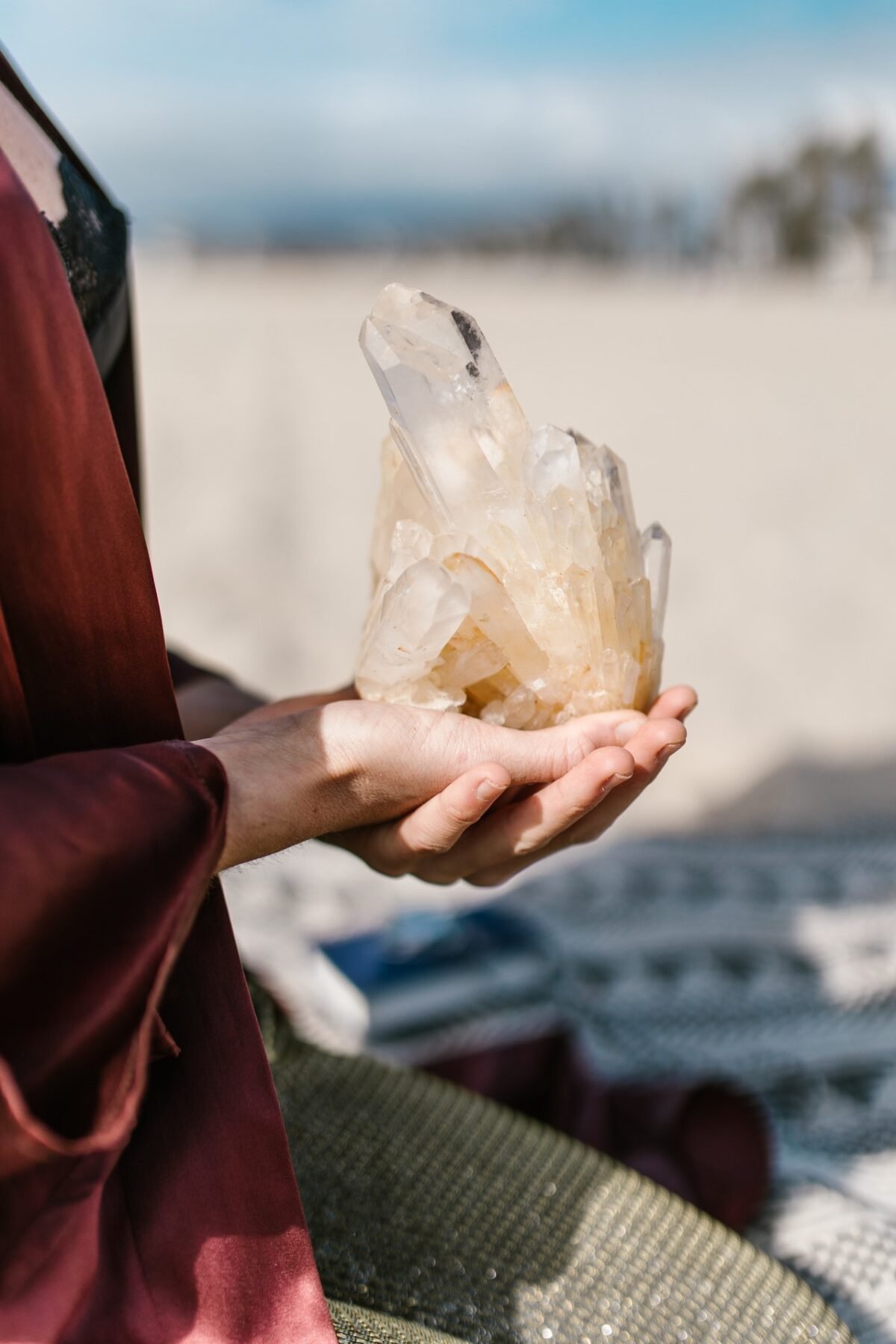 person holding a crystal